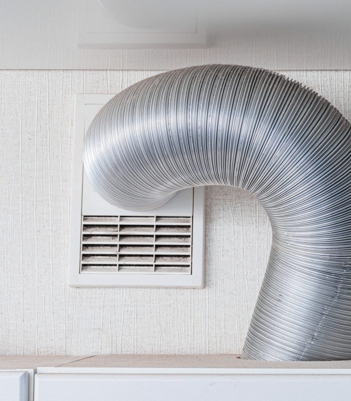 ventilation hood pipe in kitchen in modern apartment. Fan and exhausting system